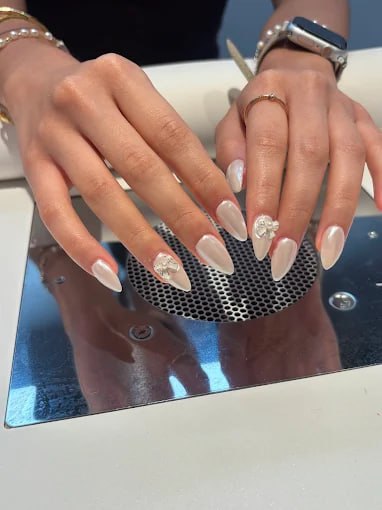 Korean gel nail art with ribbon design